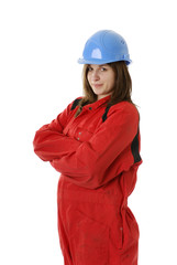 young female manual worker in coveral and helmet