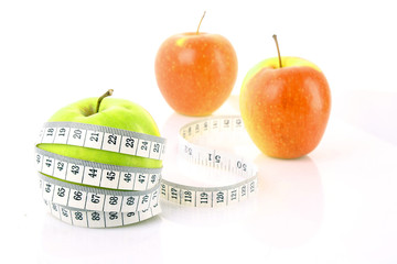 Apples and a measure tape, diet concept