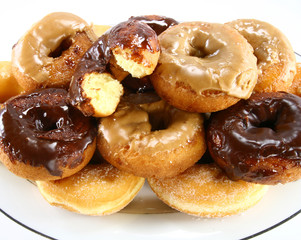 Donut platter with one part eaten