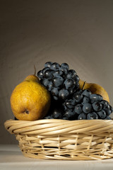 fresh tasty fruit in the bast basket  still-life