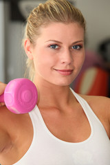 Closeup of woman working out in gym