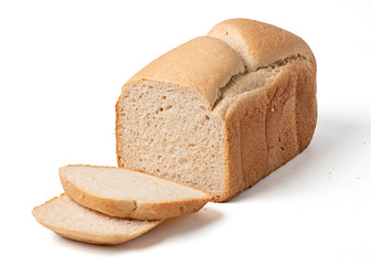 Bread loaf with slices isolated on white