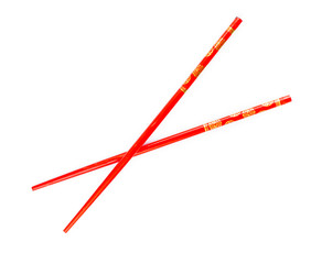 Pair of red chopsticks isolated on white background