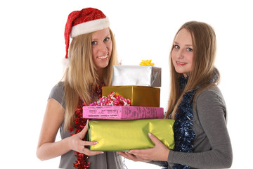 Beautiful young women with gifts for Christmas and New Year - is