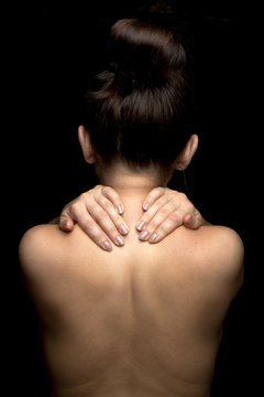 Woman with pain in her neck.