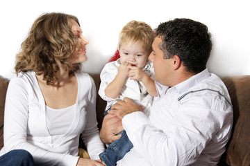 young happy family at home over white