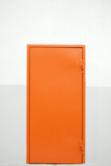 closed orange factory door © zmkstudio