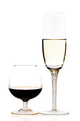 Glasses of red and white wine on a white background
