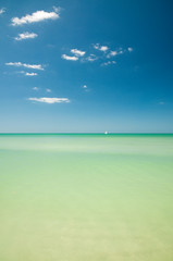 Distant boat on turquoise water
