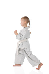 girl - karateka in kimono on a white background