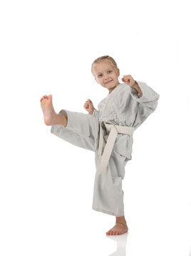 girl - karateka in kimono on a white background