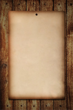 Old paper on wood wall background