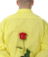 man in a yellow shirt holding a red rose