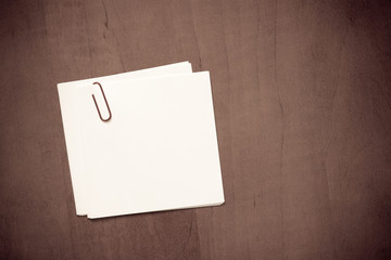 White paper note with a clip