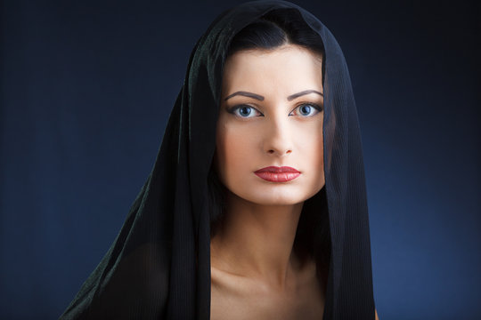 Portrait of elegant beautiful woman in shawl