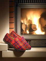 Shoes by the fireplace at Christmas. Waiting for the Magi