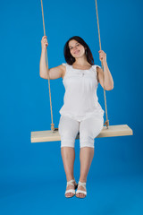 pregnant woman on a swing
