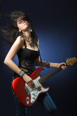 Beautiful dancing girl with a guitar