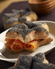 Small bread with poppy grains and smoked salmon