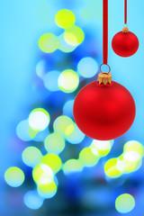 Fototapeta premium Red glass ball and magic blur christmas tree