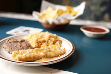 Enchiladas with rice and beans.