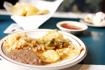 Enchiladas with rice and beans.