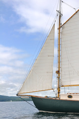 Fototapeta premium Jib, Foresail, and Wooden Mast of Schooner Sailboat