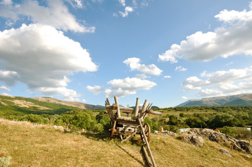 mountain landscape with a peasant cart