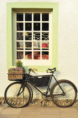 Fototapeta na wymiar Bike Outside an Old-Fashioned Shop
