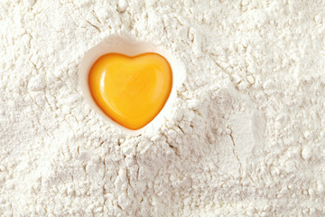 love to bake it!  egg  yolk on flour, full frame - obrazy, fototapety, plakaty