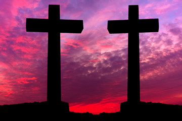 Crosses silhouette over a dramatic sky at sunset