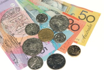 Australian banknotes and coins on plain white background