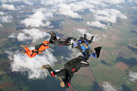 Five skydivers in freefall