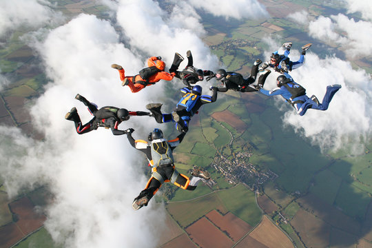 Eight skydivers in freefall