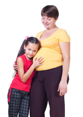 The girl listens to a stomach of mother