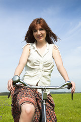 Fototapeta na wymiar Girl with a bicycle