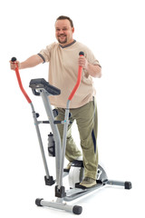 Fototapeta na wymiar Man exercising on elliptical trainer