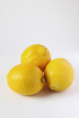 three lemons on white background