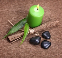 candle, leaf and stones