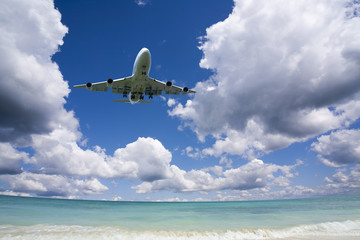Beautiful sea and sky with airplane .