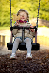 little happy girl on the swing © photomim