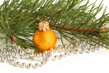 Christmas ball and green spruce branch