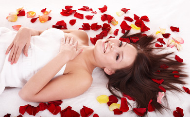 Naklejka na ściany i meble Young woman on massage table in beauty spa.