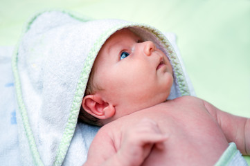 Fototapeta na wymiar baby in a bath towel