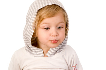 Little cute girl making a serious face