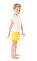 fretful little girl standing on white background