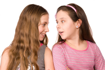Two girls in the age of ten and eleven talking