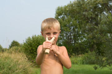 Boy with a slingshot.