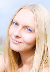 Summer portrait of the beautiful fair-haired girl