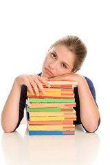 Tired female student with books